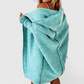 Turquoise hooded longline knit cardigan with draped cowl hood and ribbed cuffs