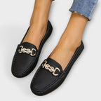 Women's lightweight leather loafer, black side view with gold buckle ornament