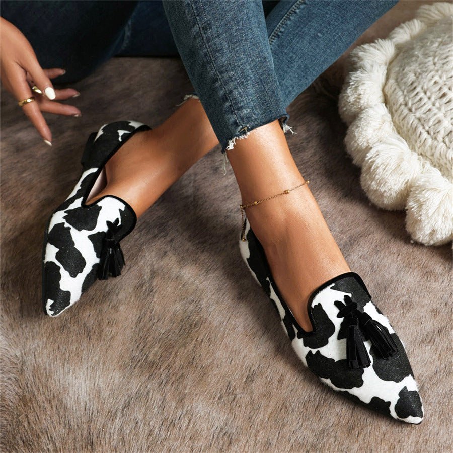 Women's pointed animal-print tassel loafers, black-and-white pattern with black tassels