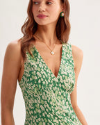 Green floral sleeveless mini dress with V-neck and gathered pleats at the waist