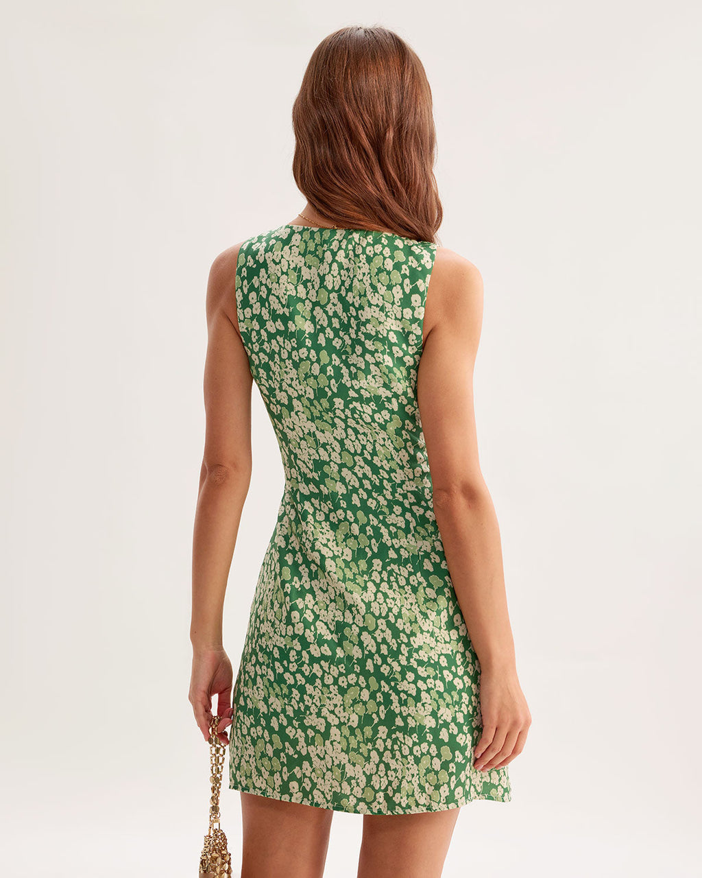 Green floral sleeveless mini A-line dress, open-back V shape, rear seam