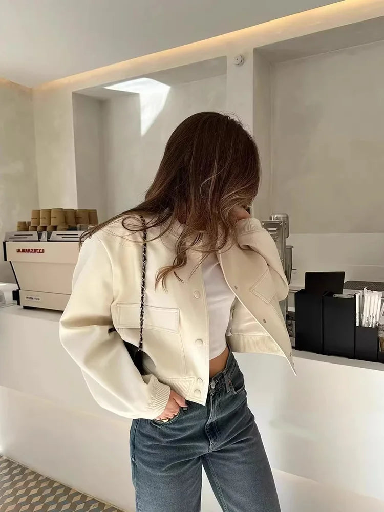 Light cream cropped bomber jacket back view with ribbed hem and cuffs