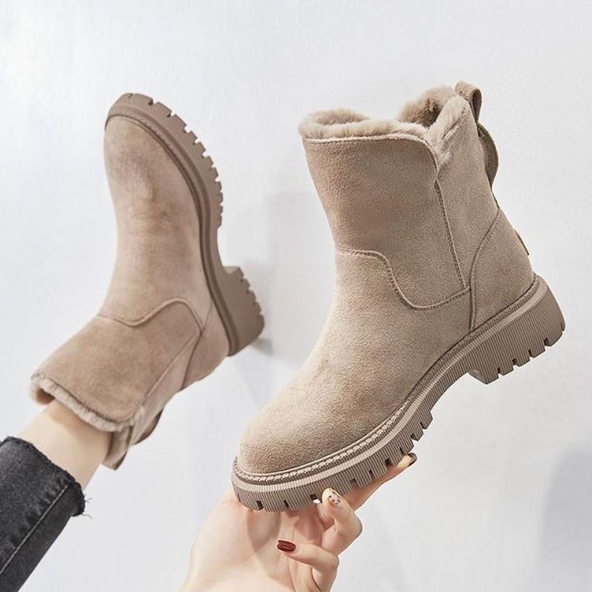Beige ankle winter boots with warm lining, side zipper, and thick tread for grip
