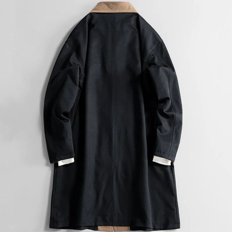 Black long coat back view with tan collar and long sleeves