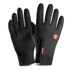 Black heated winter gloves with textured grip and red logo patch on wrist
