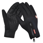 Black heated gloves with textured palm, red label patch, and zipper pull at cuff