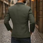 Back view of a military green corduroy jacket with Mao collar and button details