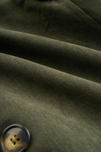 Military green corduroy jacket fabric close-up with fine ribbed texture