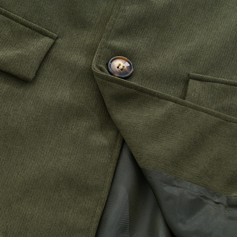 Military green corduroy jacket close-up of sleeve seam and buttoned cuff