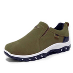 Men's olive green slip-on hiking shoes with padded collar, white midsole, and dark tread