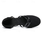 Black dance heels showing open heel cutout and adjustable ankle strap