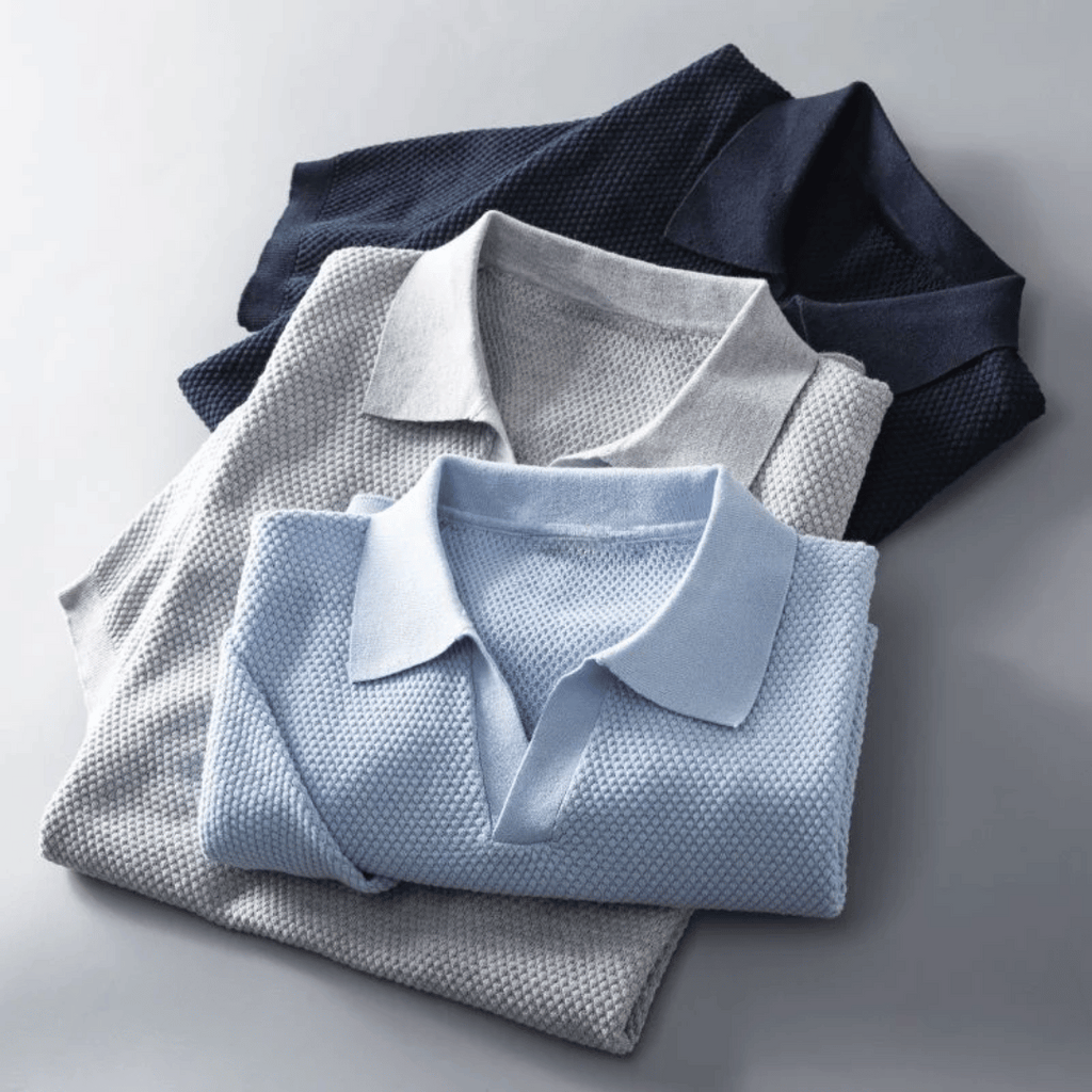 Stack of men's knitted polo shirts in light grey and sky blue, short-sleeve collared style