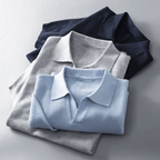 Stack of men's knitted polo shirts in light grey and sky blue, short-sleeve collared style