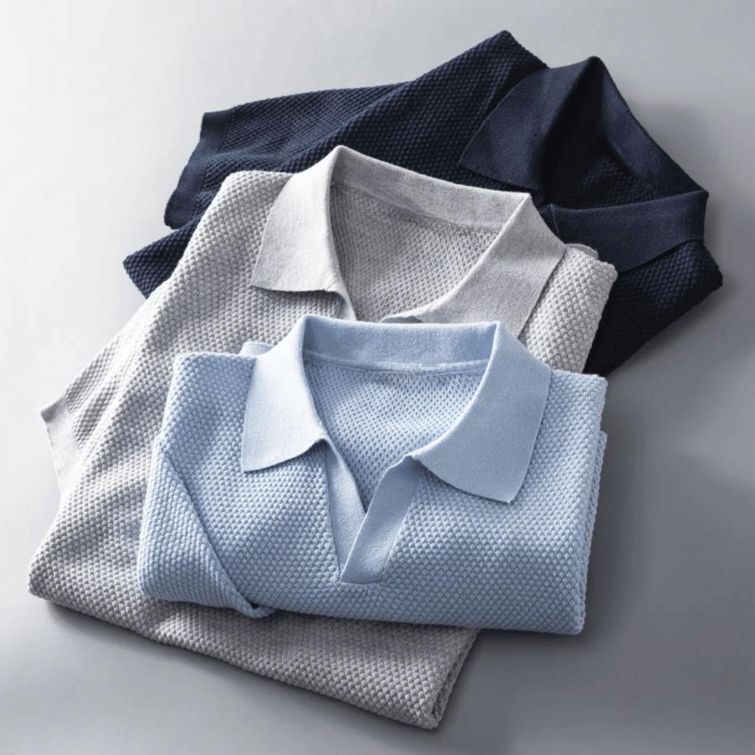Stack of men's knitted polo shirts in light grey and sky blue, short-sleeve collared style