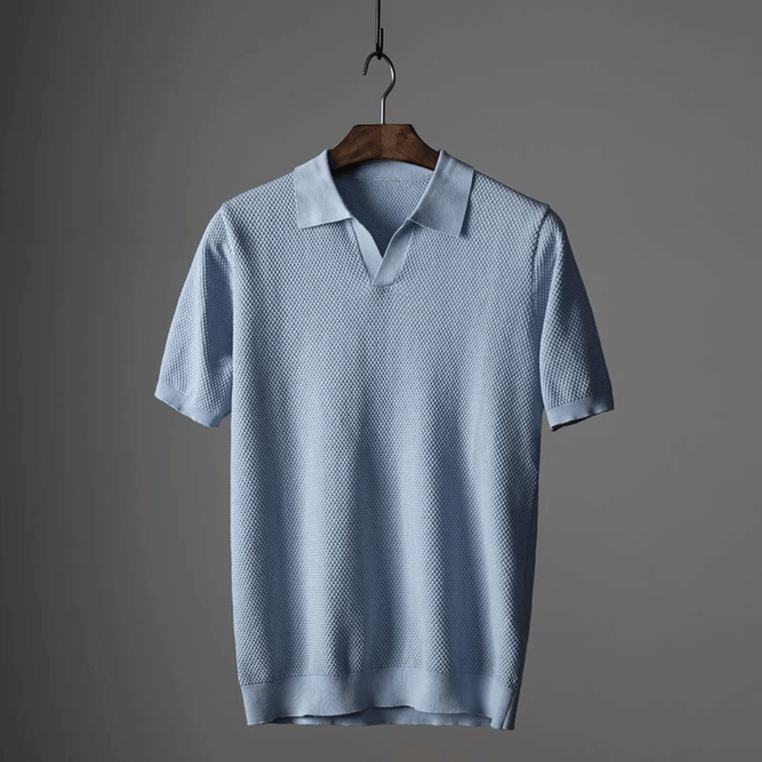 Sky blue men's knitted polo shirt hanging, short sleeves and collared placket