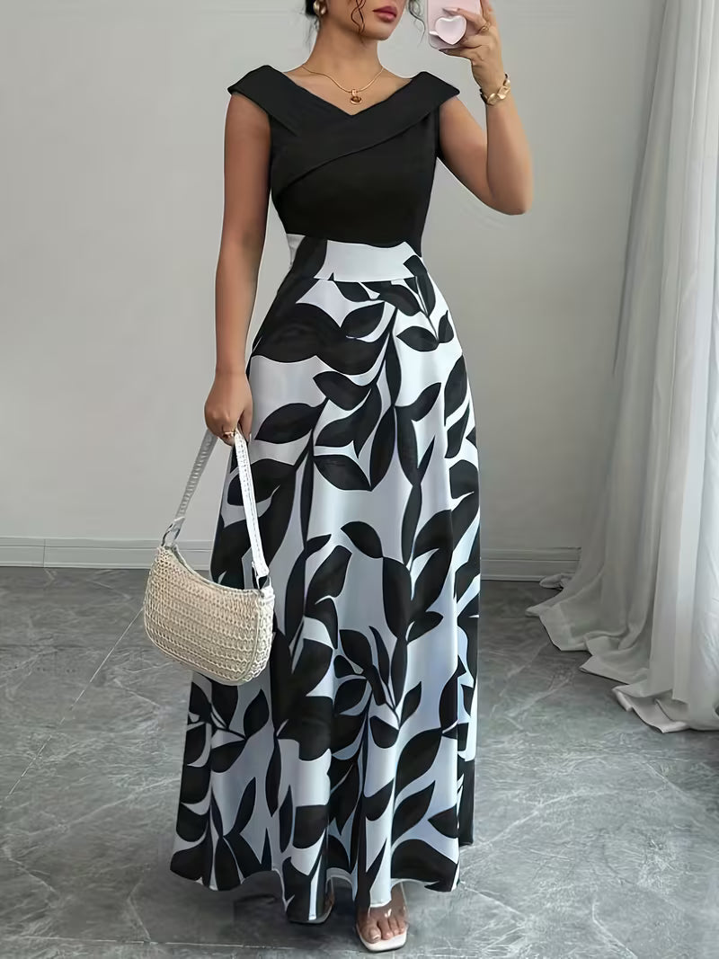 Black sleeveless maxi dress with leaf print, V-neck wrap bodice and flowing skirt