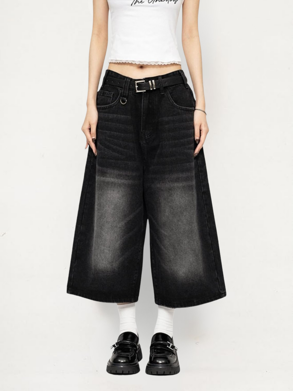 Black high-waisted wide-leg denim culottes with wide legs, pockets, and belt loops