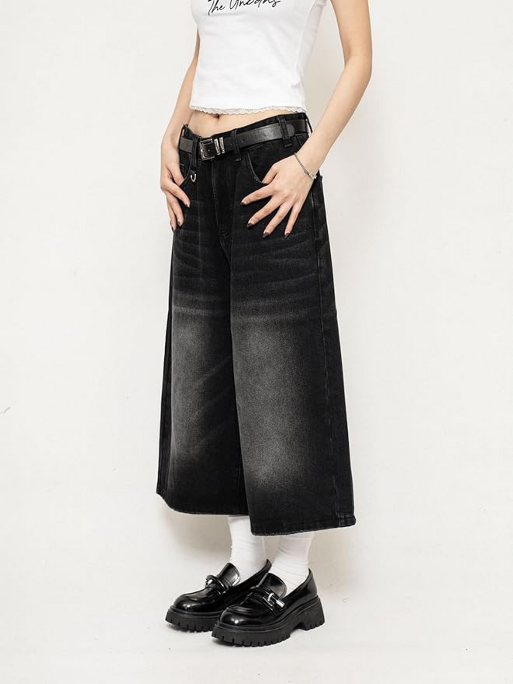 Black high-waisted wide-leg denim culottes with leather belt and side pockets