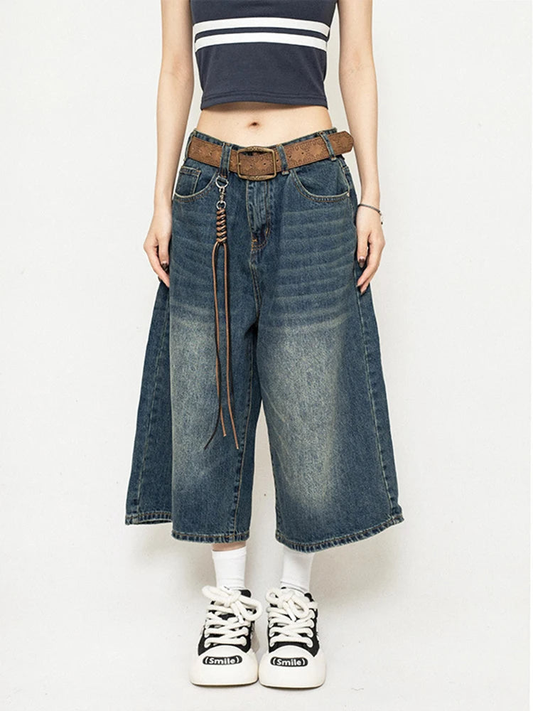 Retro blue high-waisted wide-leg denim culottes with leather-look belt and front pockets