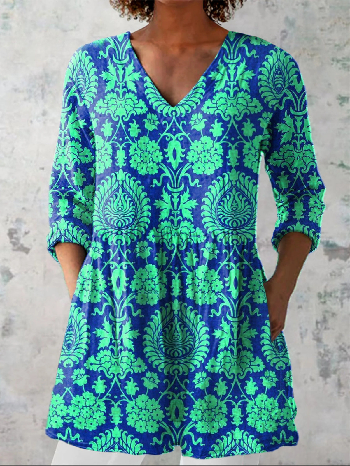 Teal v-neck blouse with ornate floral and paisley print, three-quarter sleeves