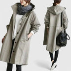 Light gray hooded coat with button front and long sleeves, side pockets
