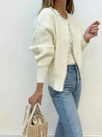 Ivory knit open cardigan with long pearl trim placket and frayed edge