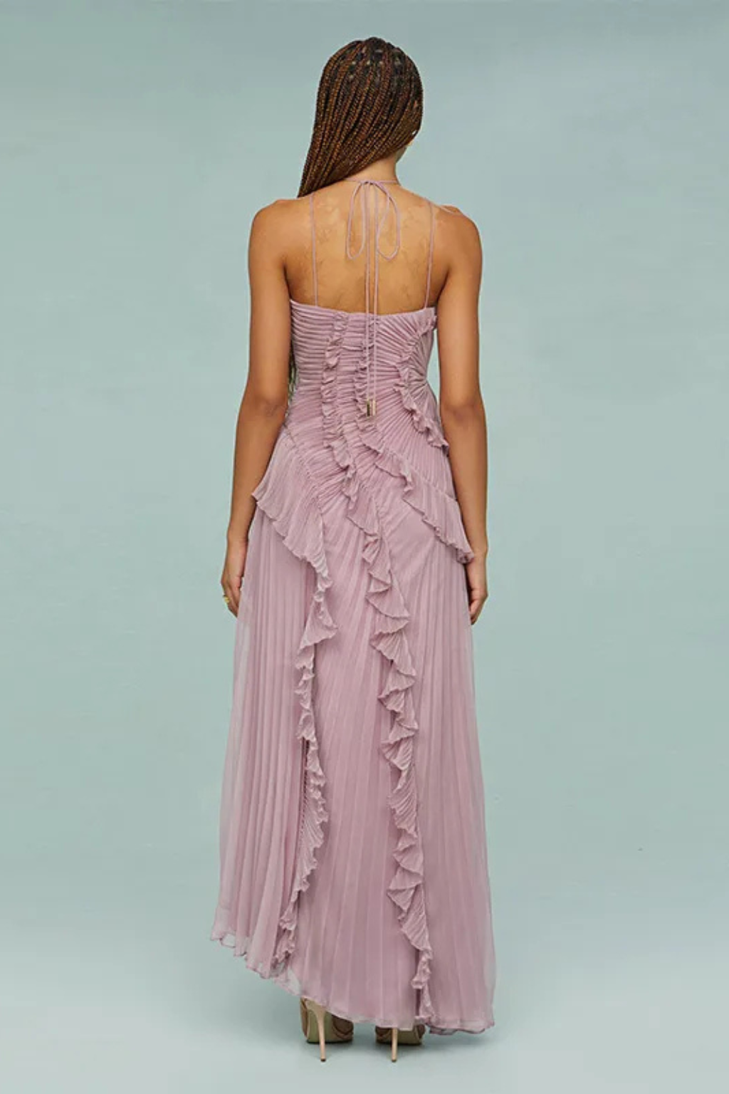 Pink halter ruffled maxi dress with open back and asymmetric layered hem
