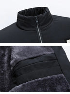 Black padded jacket detail: stand collar and textured lining near zip