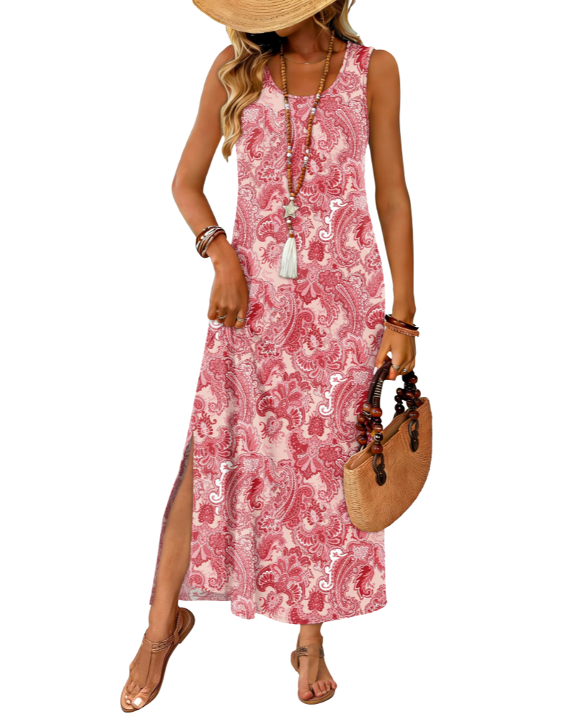 Sleeveless maxi dress in pink with paisley print, round neckline, side slit hem.