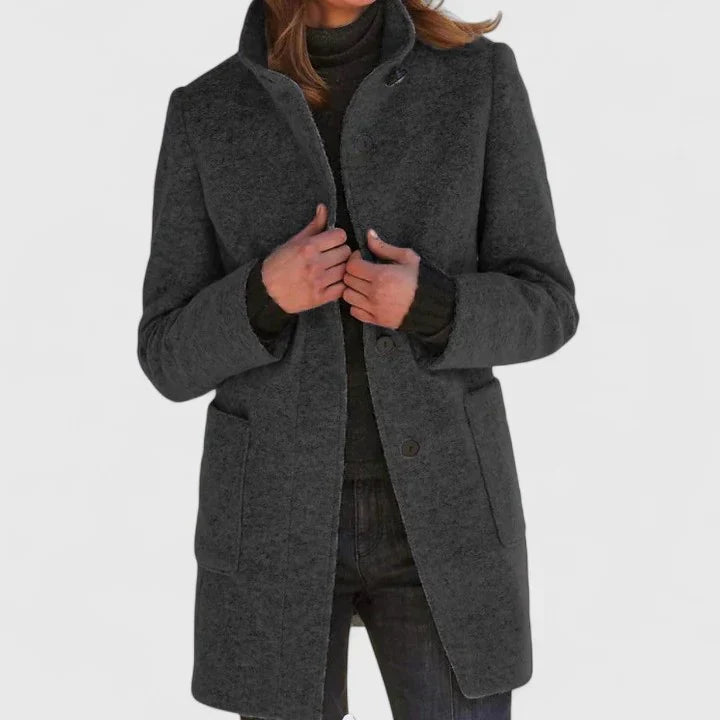 Black elegant coat with button front, notched lapels, and side pockets
