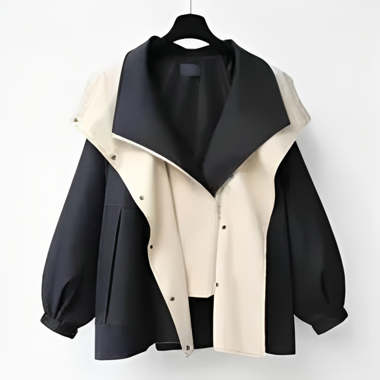 Two-tone windbreaker jacket with snap front and drawstring cuffs, black and cream