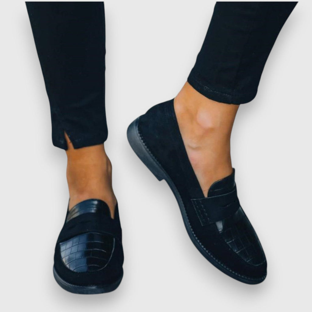 Women's black croc-textured leather flat slip-on loafers, side profile