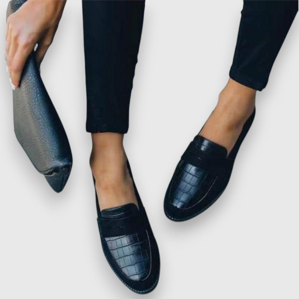 Women's black croc-embossed leather flat slip-on loafer, strap and close-up view