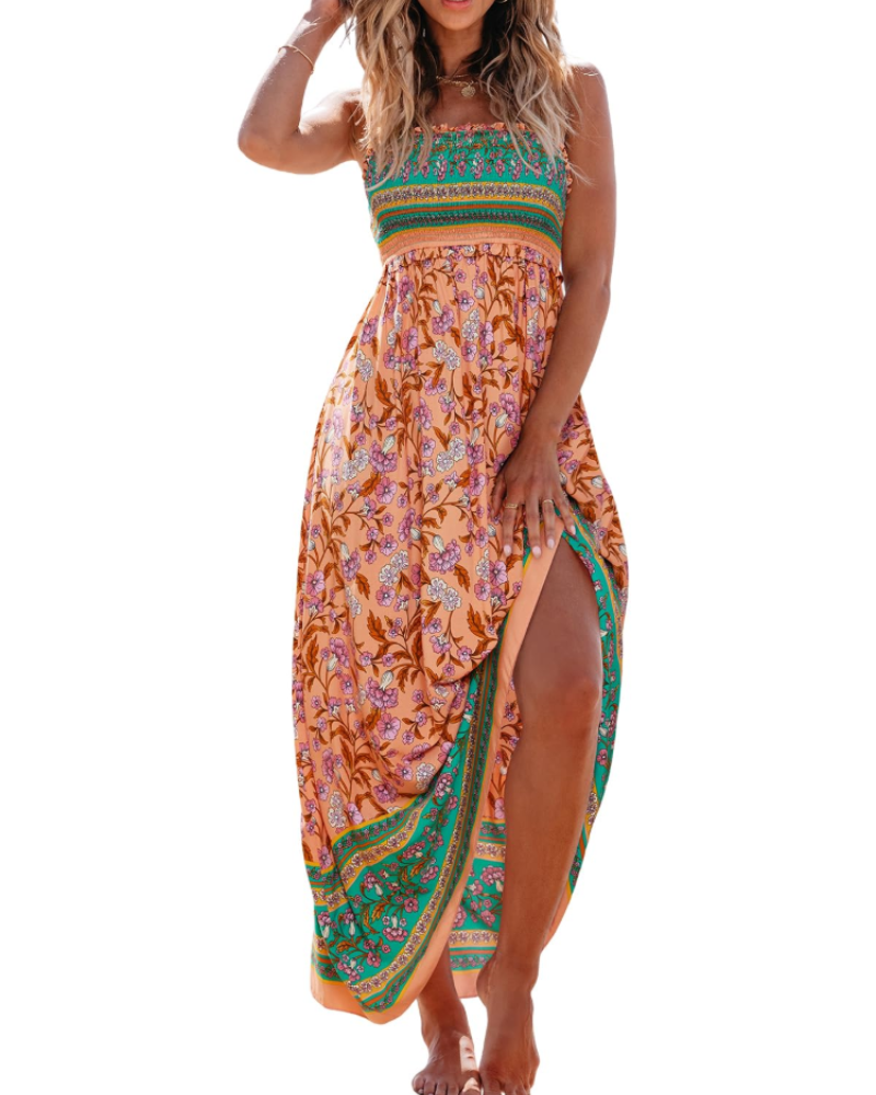 Floral smocked maxi dress with thin straps, ruffled hem, side slit; peach with green trim