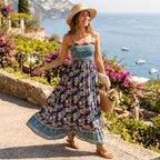 Floral maxi sundress with smocked bodice, thin straps, and ruffled hem, tiered skirt