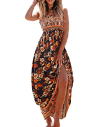 Floral smocked maxi dress, black floral print with orange accents and side slit