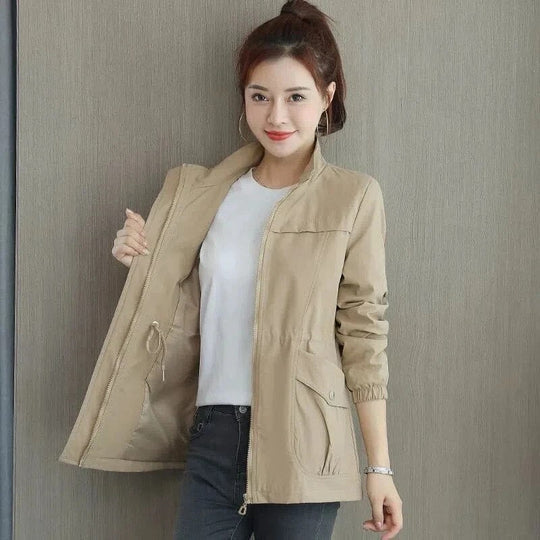 Beige high-neck full-zip jacket with drawcord waist and two side pockets