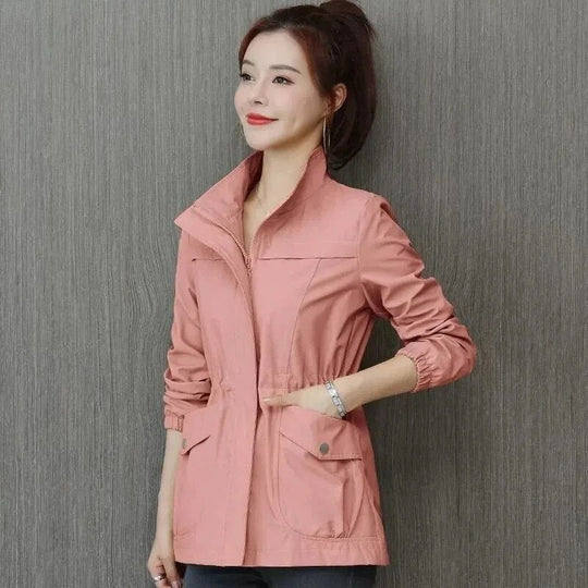 Pink high-neck full-zip jacket with flap chest pockets and relaxed fit