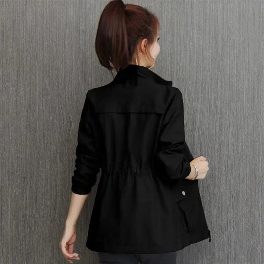 Black high-neck full-zip jacket with flap pockets and gathered elastic hem, back view