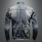 Back view of light blue vintage denim jacket with centered seam and yoke stitching