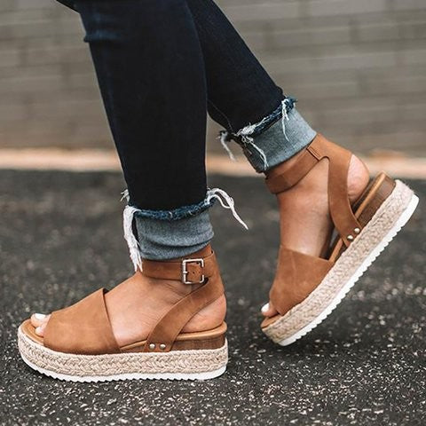Brown ankle-strap wedge platform sandals with open toe and jute-wrapped sole