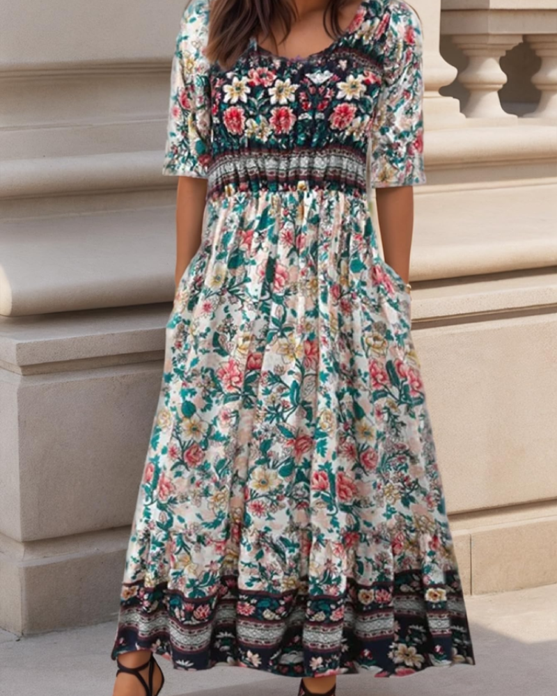Floral midi dress with short sleeves, teal and cream with dark patterned border hem