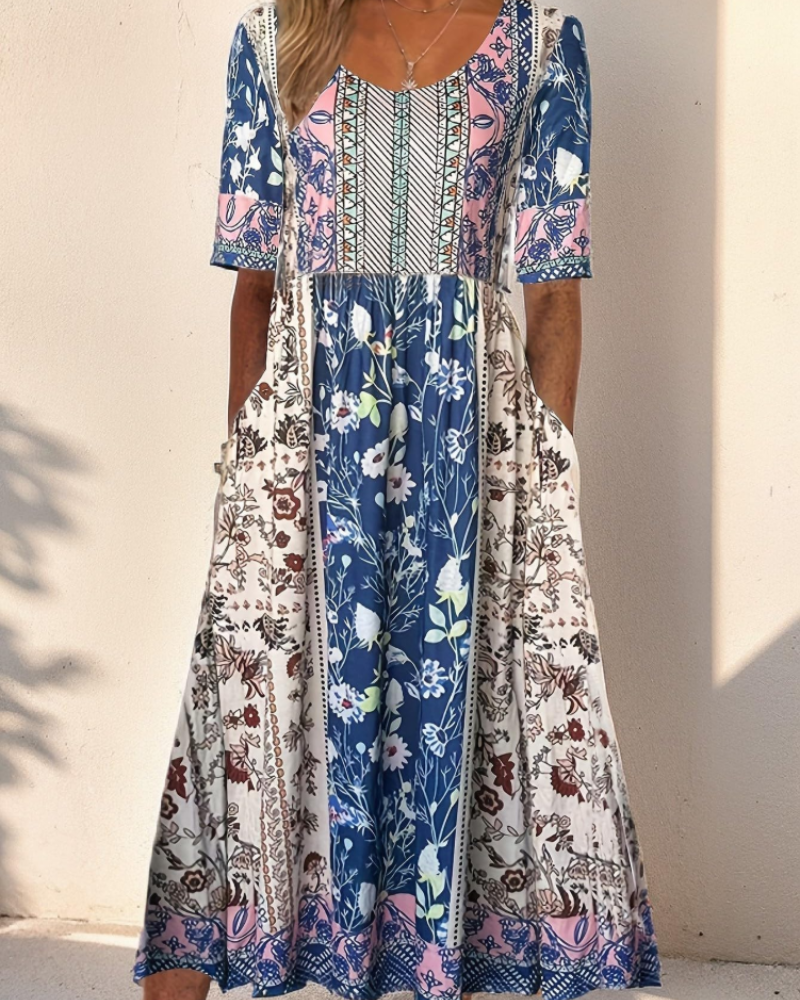 Floral midi dress with short sleeves, blue floral yoke with contrasting patchwork panels