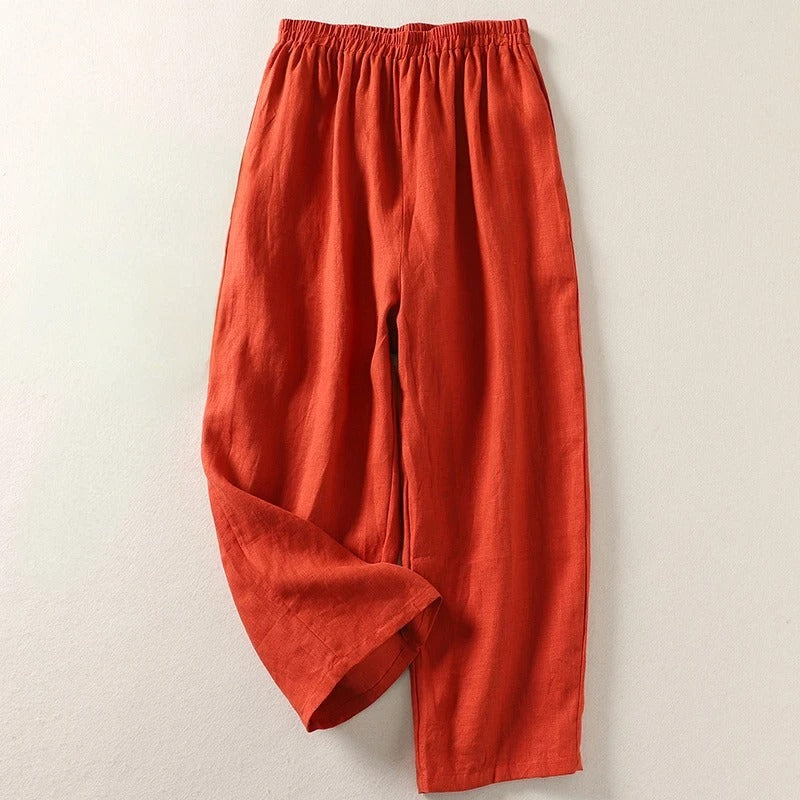 Orange wide-leg tailored trousers with elastic waistband and relaxed fit