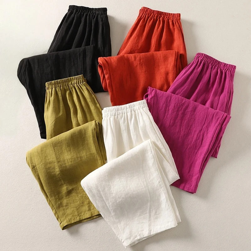 Assorted wide-leg trousers in black, olive, mustard, white, orange, and rose with elastic waist