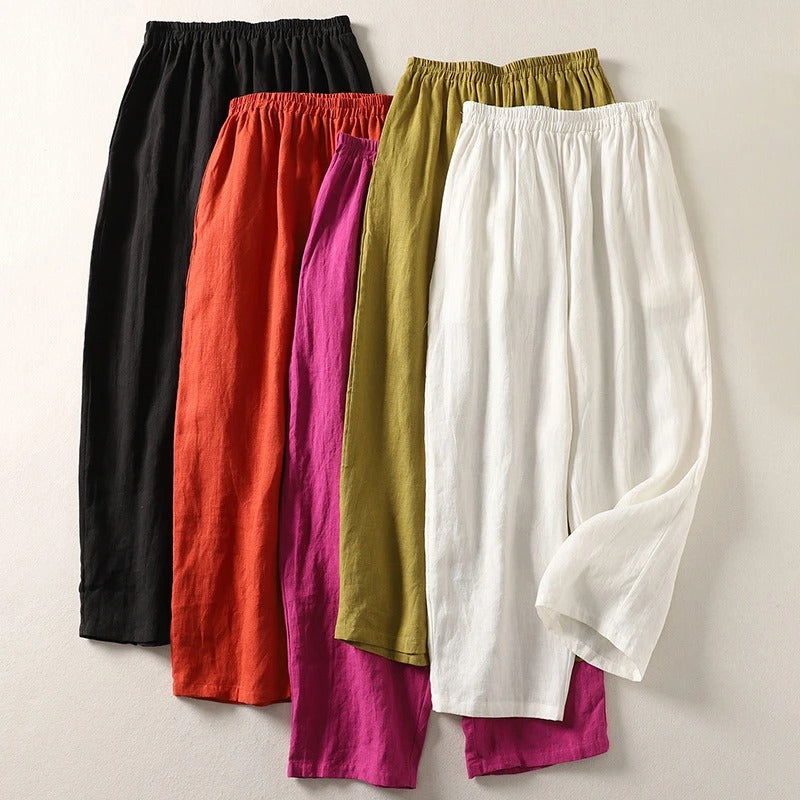 Assorted wide-leg trousers in black, orange, magenta, olive, and white with elastic waistband