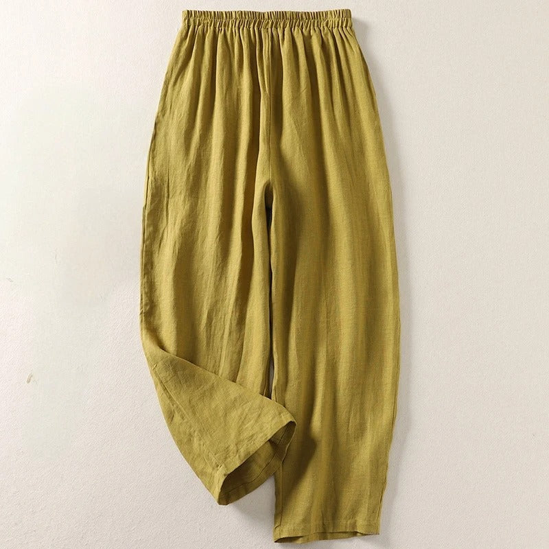 Olive wide-leg tailored trousers with elastic waistband and relaxed drape