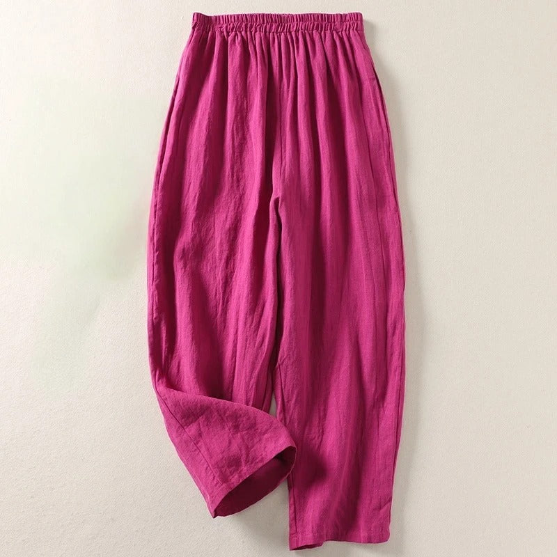 Rose/magenta wide-leg tailored trousers with elastic waistband and relaxed drape