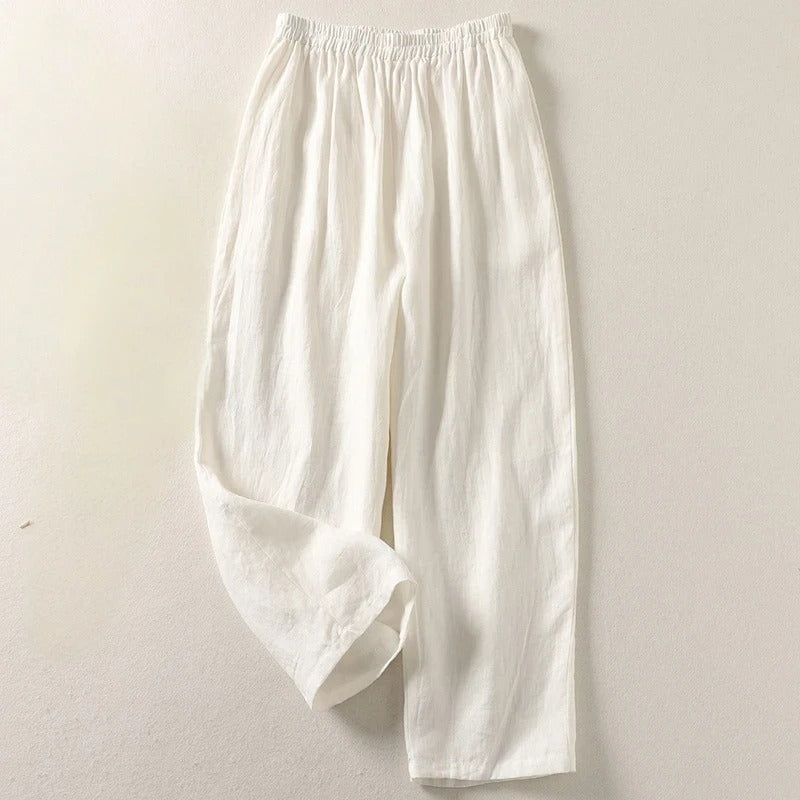 White wide-leg tailored trousers with elastic waistband and relaxed fit