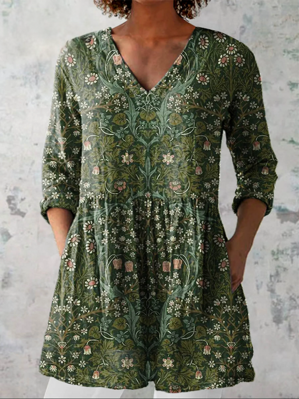 Green floral V-neck blouse with 3/4 sleeves and gathered relaxed fit